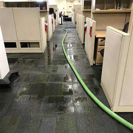 Flood damage restoration crew responding to water damage emergency